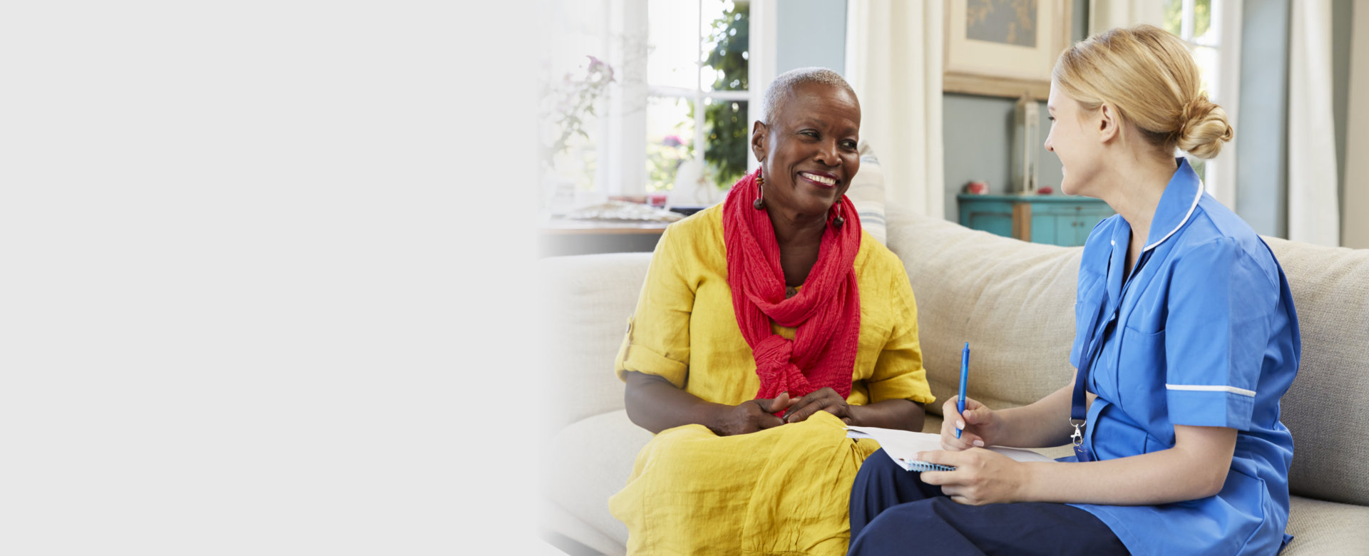 female Community Nurse Visits Senior Woman At Home