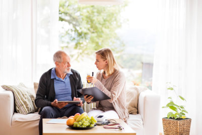 man checking the health of senior man