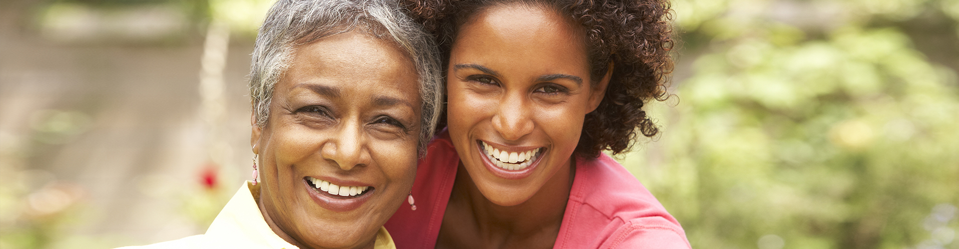 woman and senior woman smiling